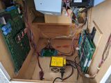 The modded PCB installed in the cabinet and connected to the JAMMA switcher along with a Galaga PCB.